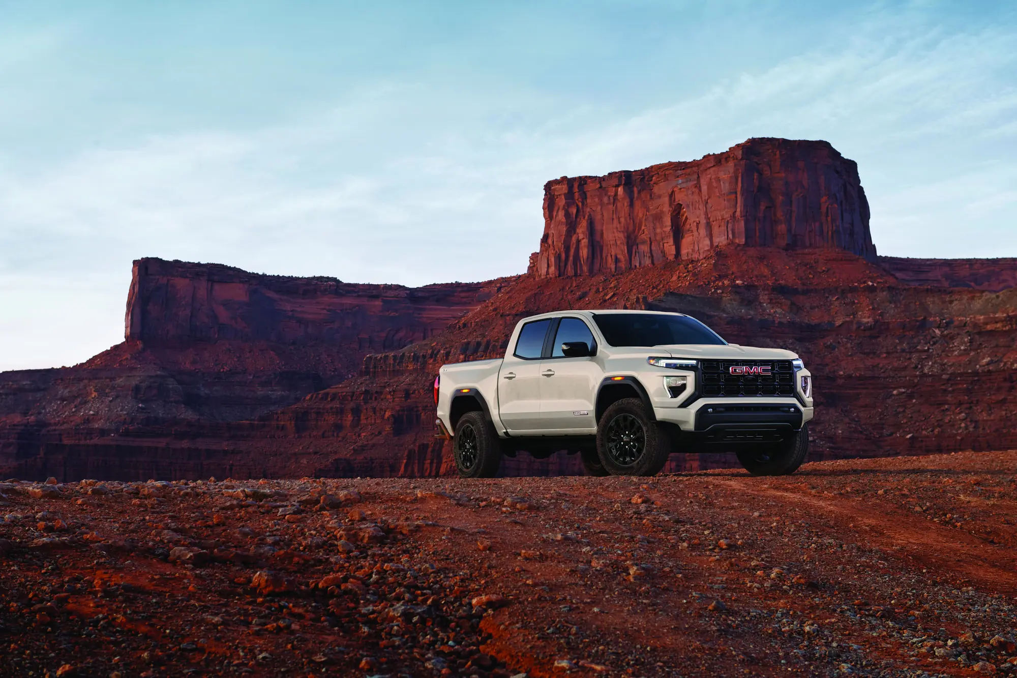 2027 GMC Canyon Elevation in Coastal Dune parked in desert canyon country