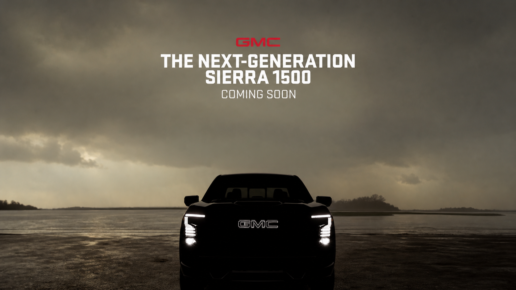 2027 GMC Sierra 1500 official teaser image showing the front-end lighting signature