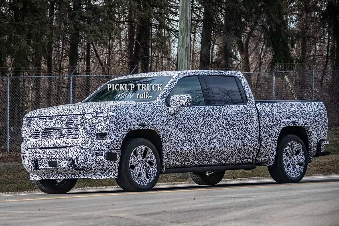 2027 GMC Sierra 1500 prototype side profile in camouflage