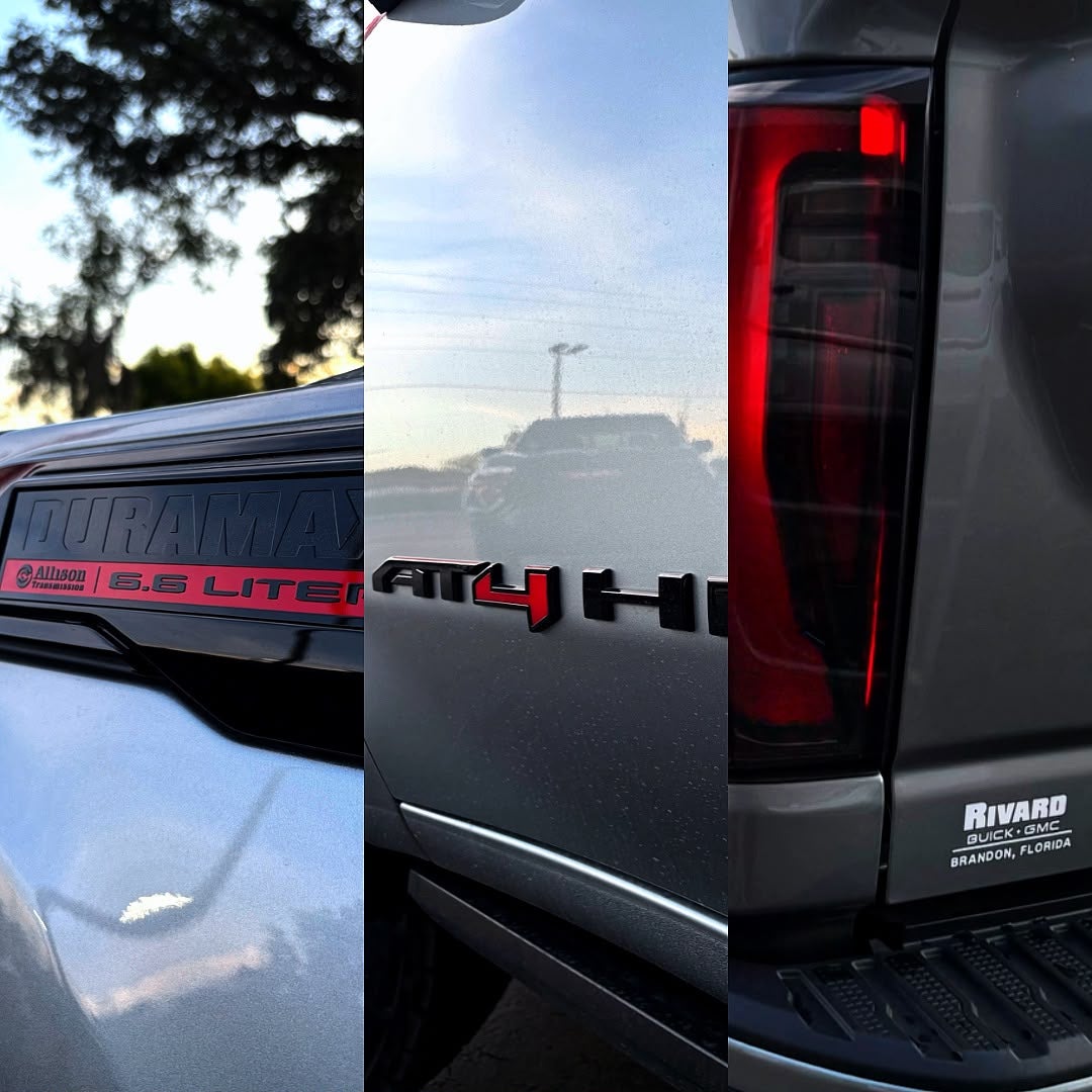 Duramax 6.6 liter badge, AT4 HD badge and Rivard Buick GMC tailgate badge detail