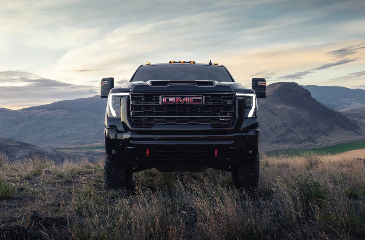 2027 GMC Sierra HD AT4X front view standing in a mountain field