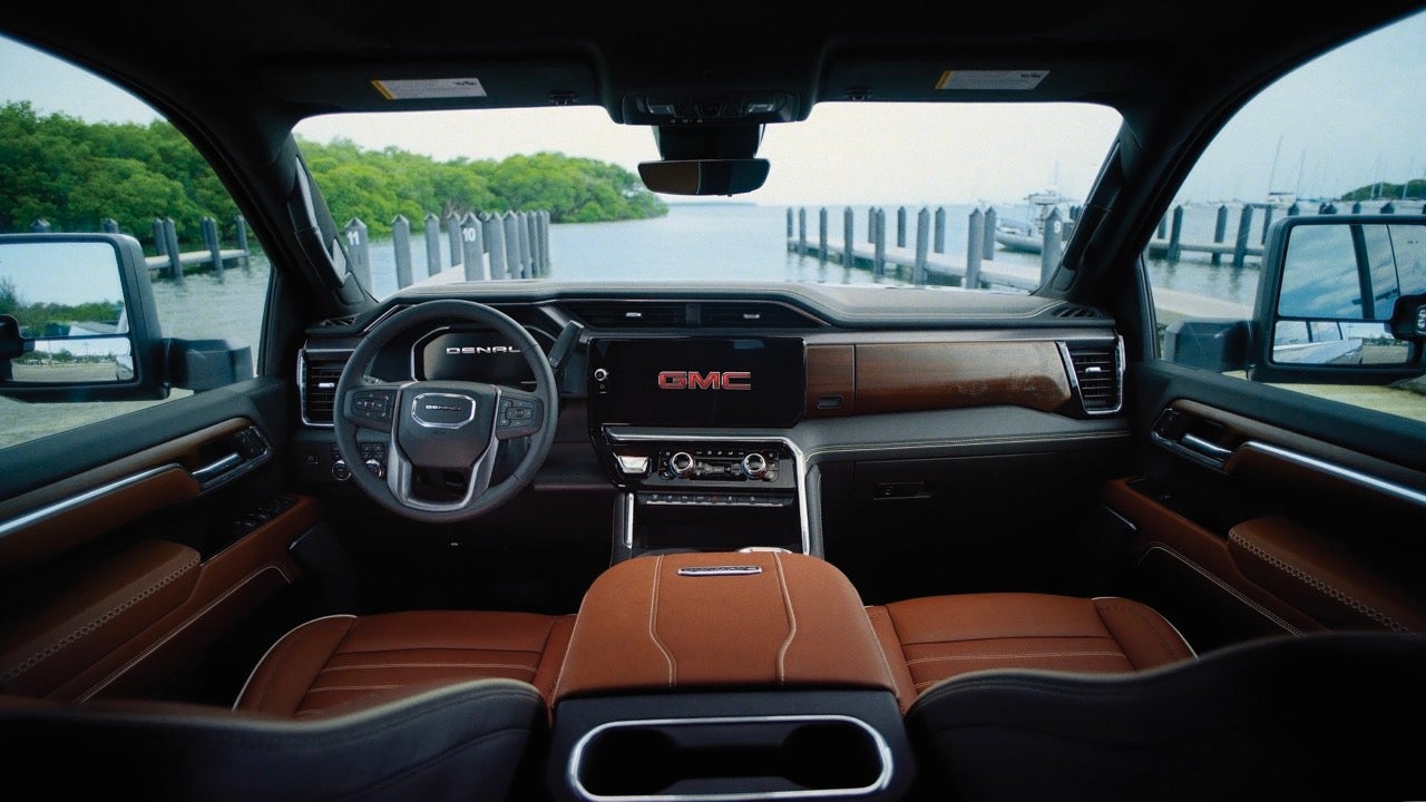 2027 GMC Sierra HD Denali Ultimate interior with open-pore wood dash and premium leather