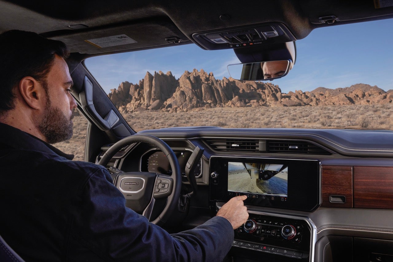 2027 GMC Sierra HD touchscreen showing trailering camera view while towing